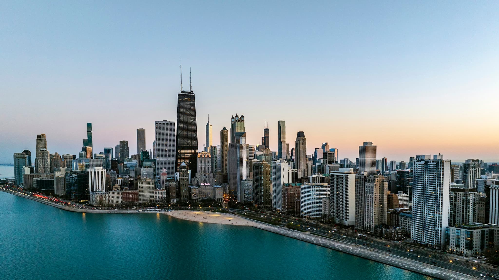 The Chicago skyline and lakefront from the air at sunset